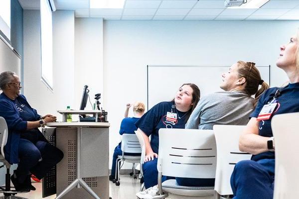 Nursing class looking at instructor 